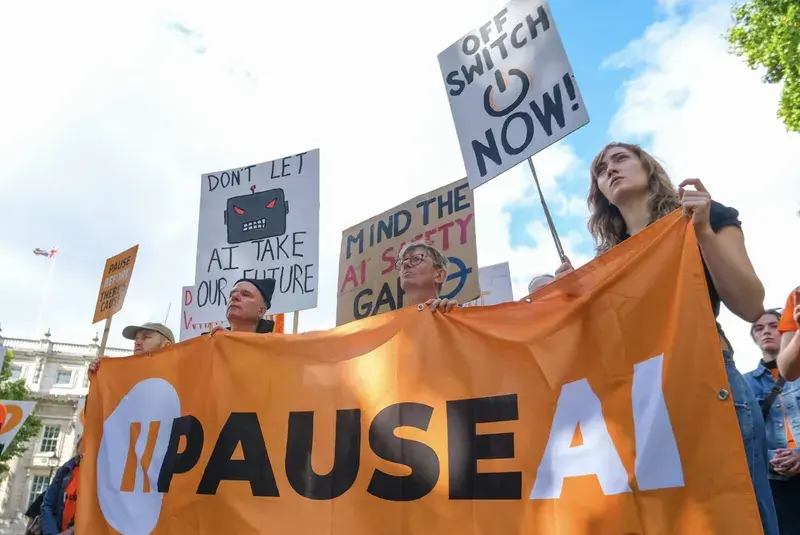 Protesters holding a PauseAI banner and placards on Whitehall, September 2026