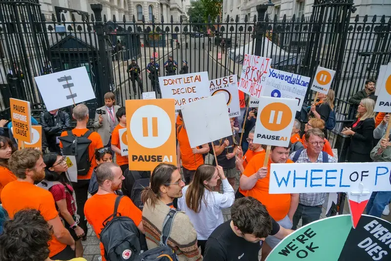 PauseAI protesters with placards at the Downing Street gates, September 2026