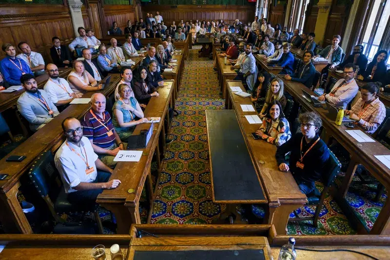 A packed committee room at the PauseAI UK discussion in Parliament, September 2026
